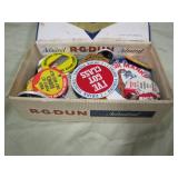 cigar box of pinback buttons