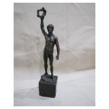 bronze statue marked >>