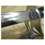 on scabbard and sabre, >