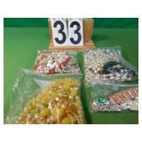 4 Bags Of Beaded Necklaces