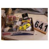 Row of Motor Cycle Parts Below Shelf (Boxed)