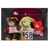 Purple Totes Full Of Larger Stuffed Animals-