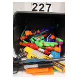 Gray Tote Of Toy Guns