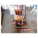 Stack of Brooms, Shovel & Scraper