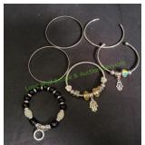 (6) Bracelets in Black Velvet Bag
