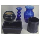 Blue glass and ceramic decorative items.