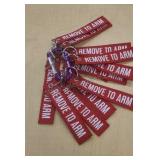 Key chains on one carabiner. Labeled "Remove to