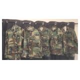 Military style camouflaged field jackets.  Sizes