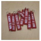 Key chains. Labeled "Remove to Arm". 8 total.