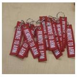 Key chains. Labeled "Remove to Arm". 12 total.