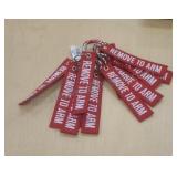 Key chains on one carabiner. Labeled "Remove to