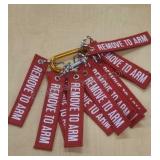 Key chains on one carabiner. Labeled "Remove to