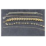 5 Gold Tone Bracelets