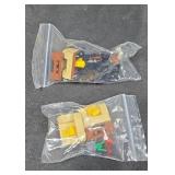 LEGO furniture and decorations in two small bags.