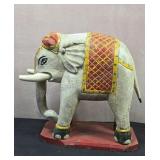Vintage wood craved elephant depicting a Temple