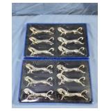 Silver plated brass knife rests.