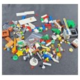 Assorted Lego pieces, trees and tool.