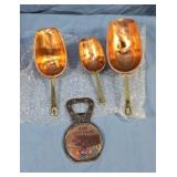 Vintage copper measuring scoops and a German