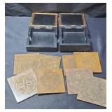 Brass covered coasters on 2 display boxes.