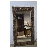 Mirror in largehand craved wood frame.