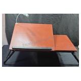 Portable laptop table with battery light.