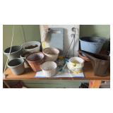 Assorted planters and garden supplies