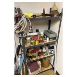 4 shelf storage rack with contents. Rack is 5