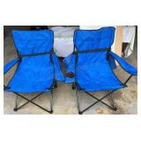 Pair of folding camp chairs in carrying bags