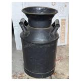 Milk jug. Metal. 19" tall. 12" base diameter.