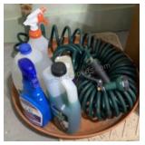 Garden hose with cleaning supplies