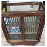 Antique display cabinet. With flag. One