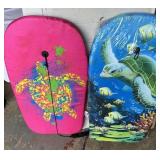 Body boards. Both look unused and one is unopened