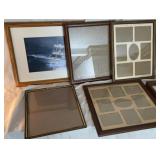 Various wooden picture and collage frames.