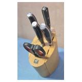 J.A. Henckels knives in knife block.  Incomplete