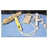 Surge protector power straps and adapter plugs.
