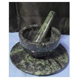 Marble mortar and pestle set with marble trivet.