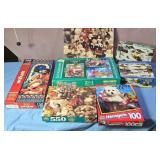 Puzzles.  Open boxes.  Pieces not verified.