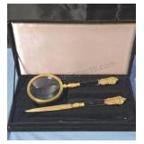 Vintage brass magnifying glass and letter opener