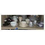 Shelf lot of tea pots, cups and saucers. Buyer