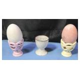 Ceramic egg cups and alabaster eggs