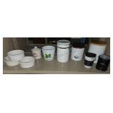 Shelf lot of ceramic items. Buyer takes what they