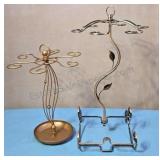 Copper colored wine glass holders.