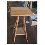 Vintage oak plant stand with lower shelf.