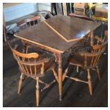 Dining table and 4 chairs. Includes 8in leaf.