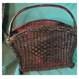 Black wicker magazine holder with cranberry