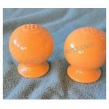 Yellow Fiesta ware salt and pepper shakers.