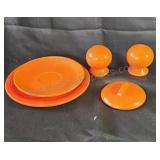 Orange Fiesta ware dishes. All pieces pictured.