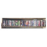 Shelf of VHS tapes some unopened