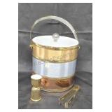 Ice bucket with shot glass and tongs.