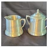 Pewter creamer and sugar bowl.